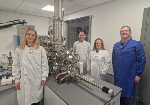 Researchers in the lab with imaging machine