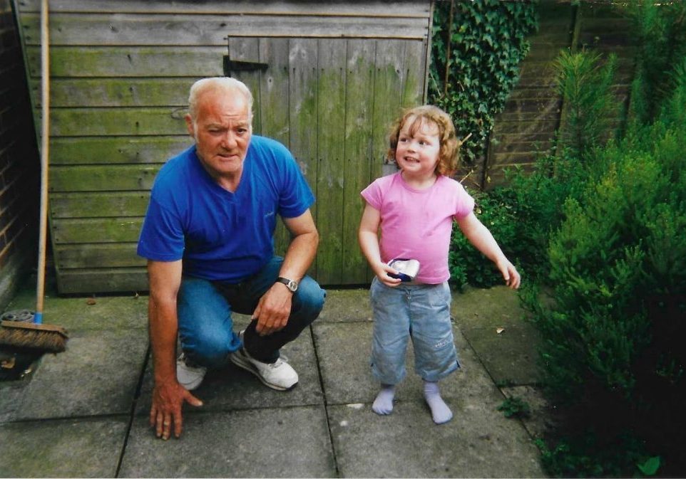 'Elvis' - Roy Owen-Jones Dad kneeling down next to small girl.