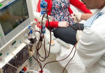 Female receiving dialysis in hospital
