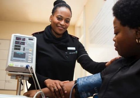 Woman having her blood pressure taken.