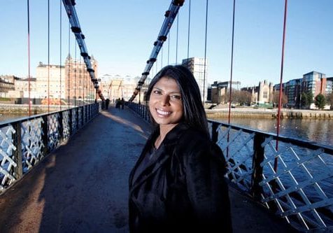 Jelina standing on a bridge during her holiday