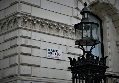 Image of the Downing Street sign on a white wall