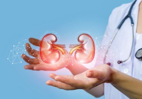 Nurse supports the person's kidney on a blue background.