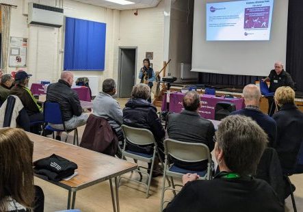 Maria presenting to a group of people with a talk about kidney disease