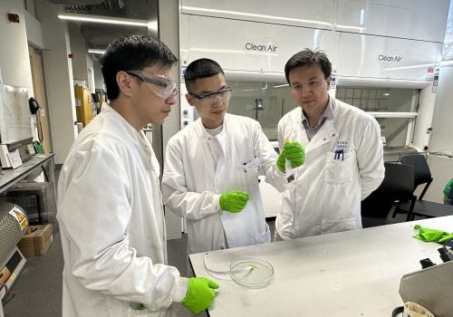 three male researchers in a lab setting