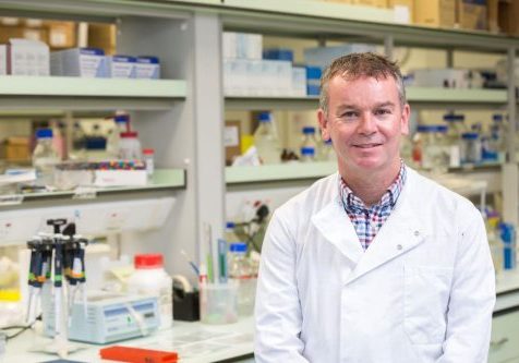 Richard Coward Man in a white lab coat in a research lab