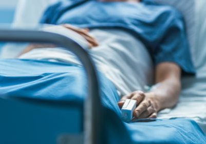 Man laying in hospital bed