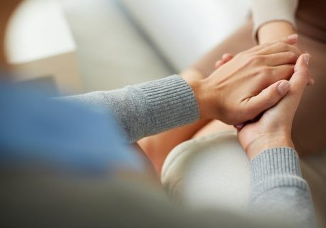 Close-up,Of,Psychiatrist,Hands,Together,Holding,Palm,Of,Her,Patient