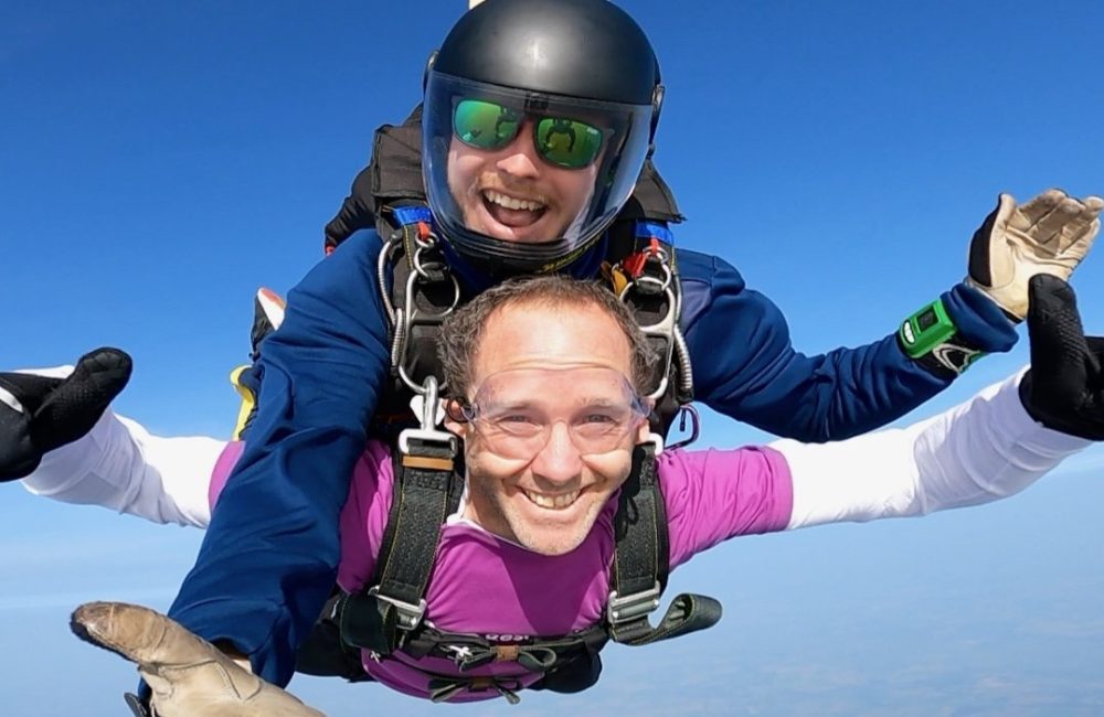 Supporter doing a tandem skydive with instructor