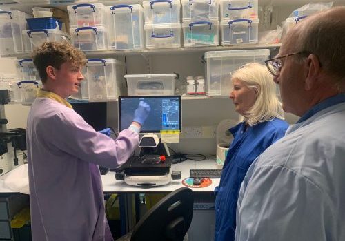 Two males and one female in the science lab.