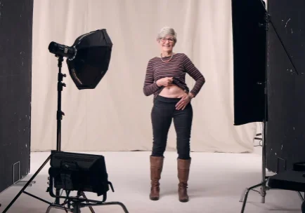 Teresa having her picture taken, showing her scar from transplant, for the Make Your Mark campaign.